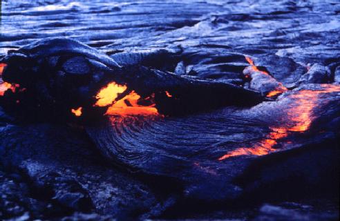 Pahoehoe lava oozing out at edge of a lava lake in Kilauea Iki, Hawaii