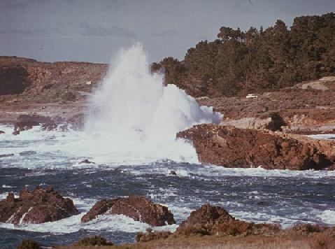 Storm waves pounding rocky coast.