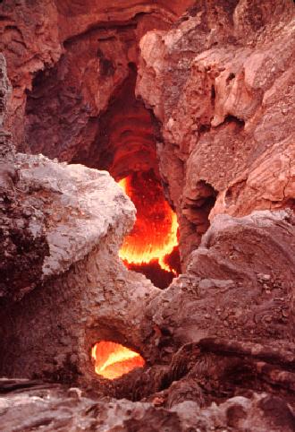 Looking down a vent to molten lava in a lava tube.